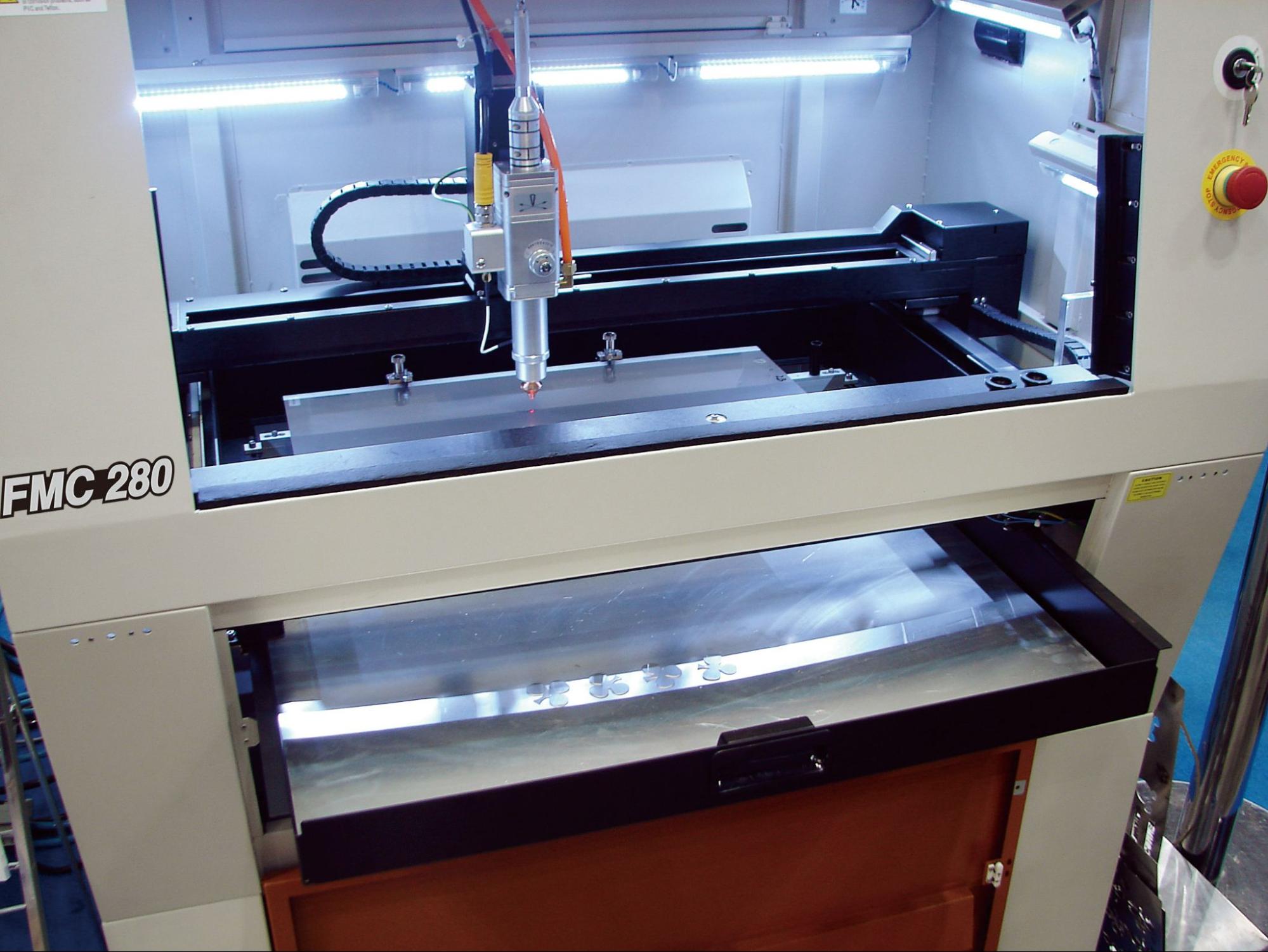 FMC 280 laser cutting machine interior with laser head and motion system